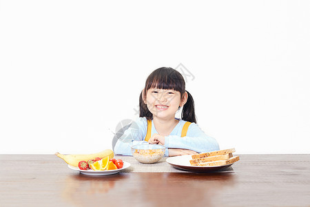 小女孩吃食物小女孩吃早餐背景