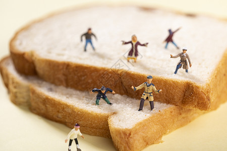 卡通烤面包创意微距卡通小人背景