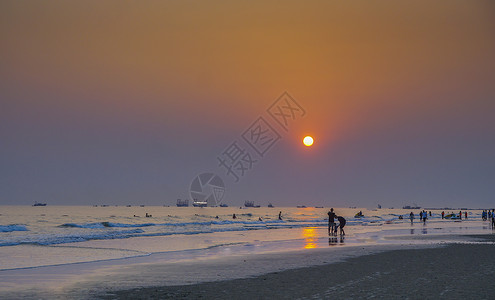 北海涠洲海边夕阳落日晚霞背影背景