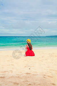 海边少女红太阳帽高清图片
