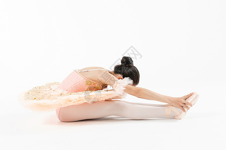 小女孩跳芭蕾舞压腿背景图片
