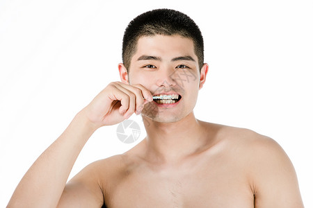 男士使用牙线背景图片