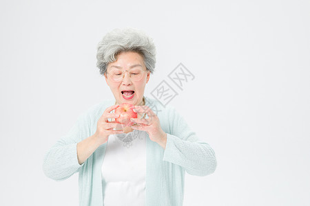 老人吃苹果老人吃苹果高清图片