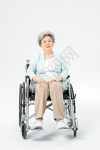 老人坐轮椅背景图片