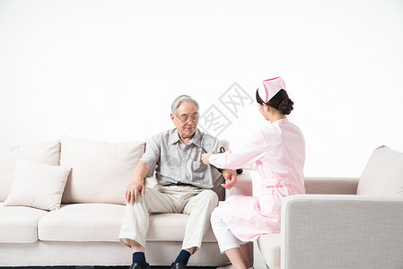 护士为老人测量血压背景图片