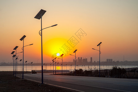 夕阳路素材风车与太阳能应用背景