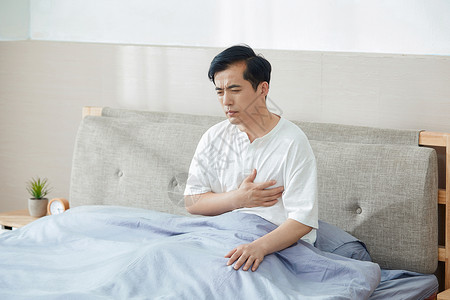 胃胀胃痛中年男士心脏疼痛背景