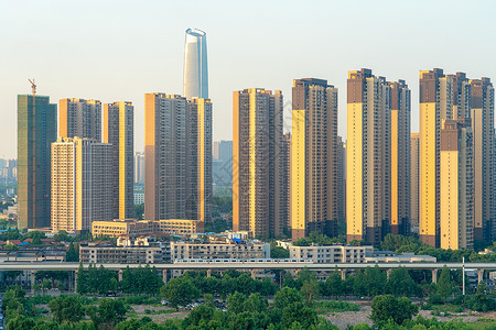 城际穿过小区楼盘的城市高速列车背景