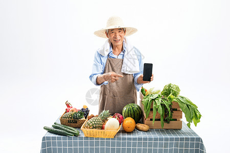 手机水果果农菜农拿着手机背景
