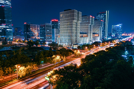 几栋万达楼北京万达广场夜晚车轨背景