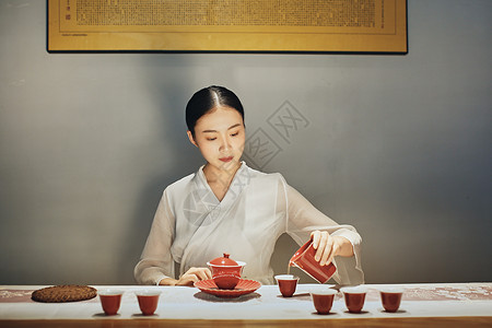 红色中国风三月你好海报厦门室内女茶艺师背景