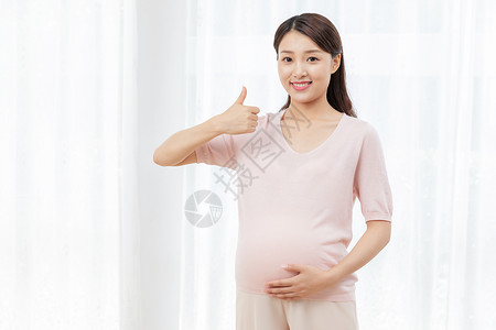 居家女人称赞举大拇指孕妇点赞背景