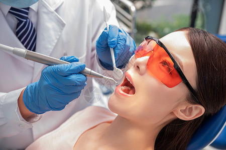 超声波洗牙牙科医生做手术背景