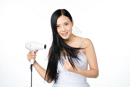 女性吹头发背景图片