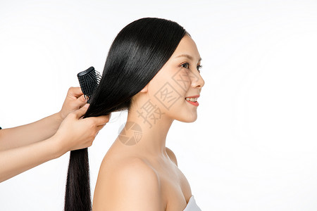 女性护发梳头背景图片