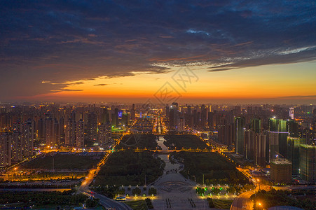 江西九江城市中轴线夕阳晚霞天空夜景高清图片