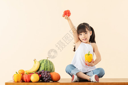 萌萌水果图标小女孩手拿水果蔬菜背景