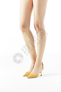 光滑腿女性光腿穿着黄色高跟鞋背景