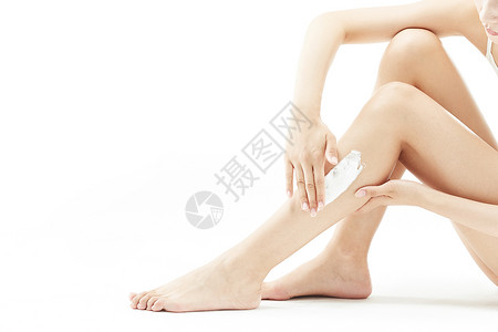 女性腿部涂抹脱毛膏特写背景图片