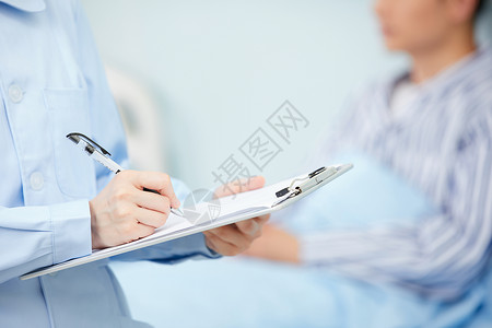 医院x展架护士记录病人身体状况手部特写背景