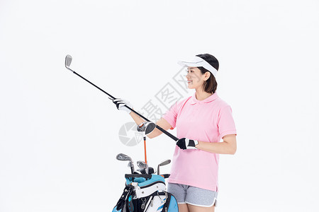 中年女性挑选高尔夫球杆高清图片