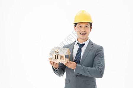 工程师拿着房子模型图片