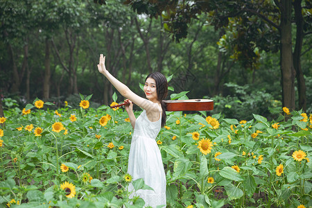 向日葵小素材肩抗吉他的少女背景