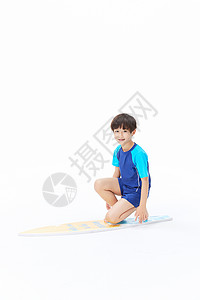 小男孩玩冲浪板图片