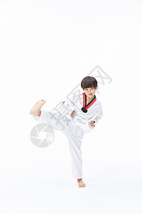 小男孩练跆拳道踢腿背景图片