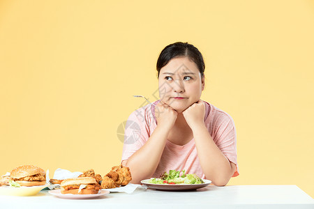 饮食瘦身胖女孩暴饮暴食背景