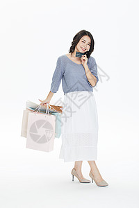 年轻美女购物消费购物袋高清图片素材