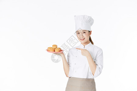 女性面点师手端面包图片
