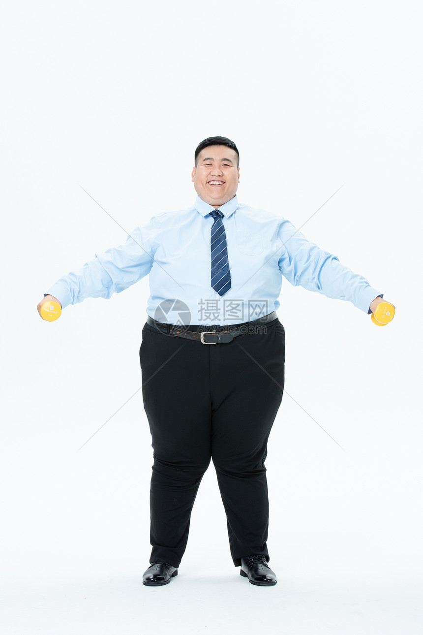 肥胖商务男性哑铃运动图片