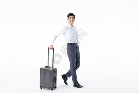 商务男性推着行李箱背景图片