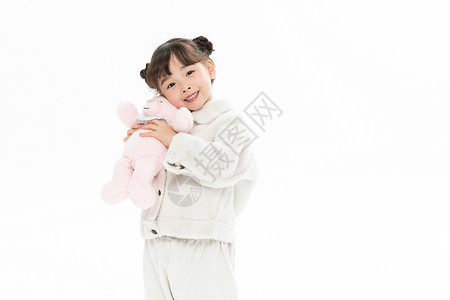 粉色小熊玩具小女孩抱小熊玩偶背景
