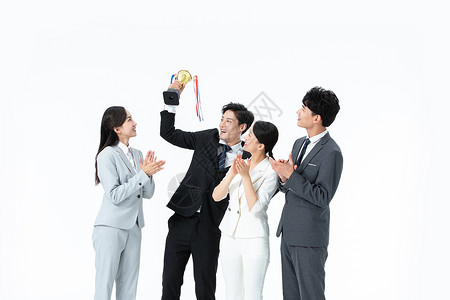 商务团队举奖杯庆祝背景图片