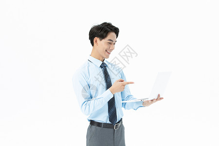 青年商务男性拿着笔记本电脑图片