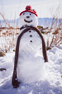 戴帽子的雪人戴帽子戴围巾的微笑雪人背景