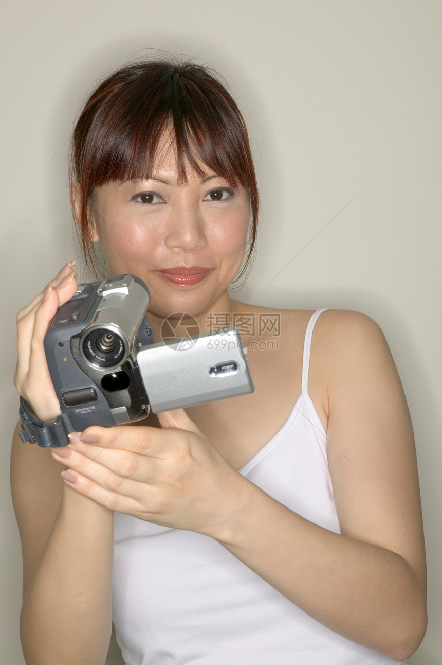 女人用摄像机图片
