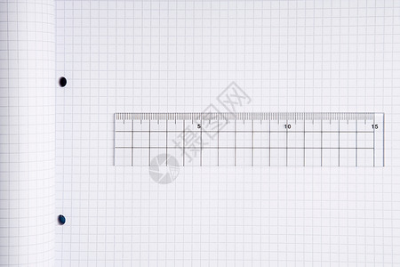 一把尺子和一本笔记本背景图片