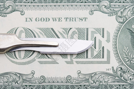 手术刀和一美元钞票图片
