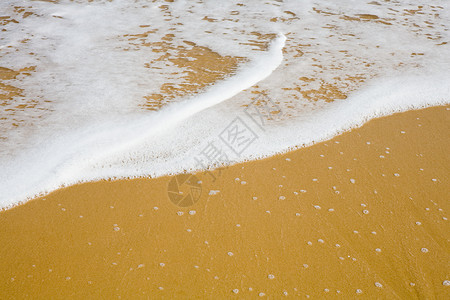 沙滩上的海浪背景图片