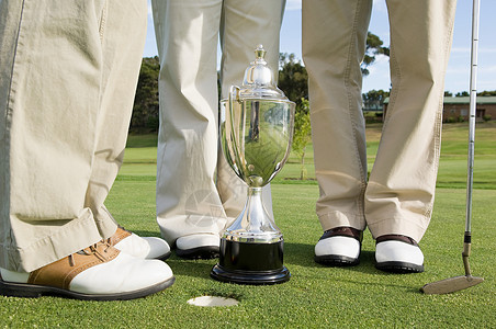 高尔夫奖杯高尔夫球手和奖杯背景