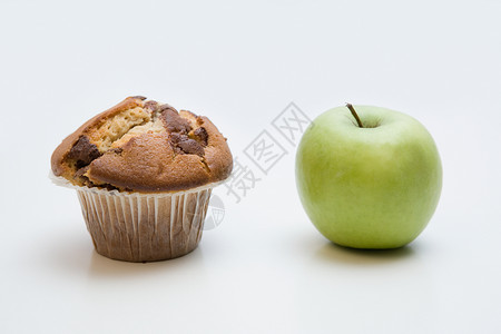 一个松饼和一个苹果背景图片