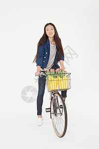带花篮骑自行车的女人图片