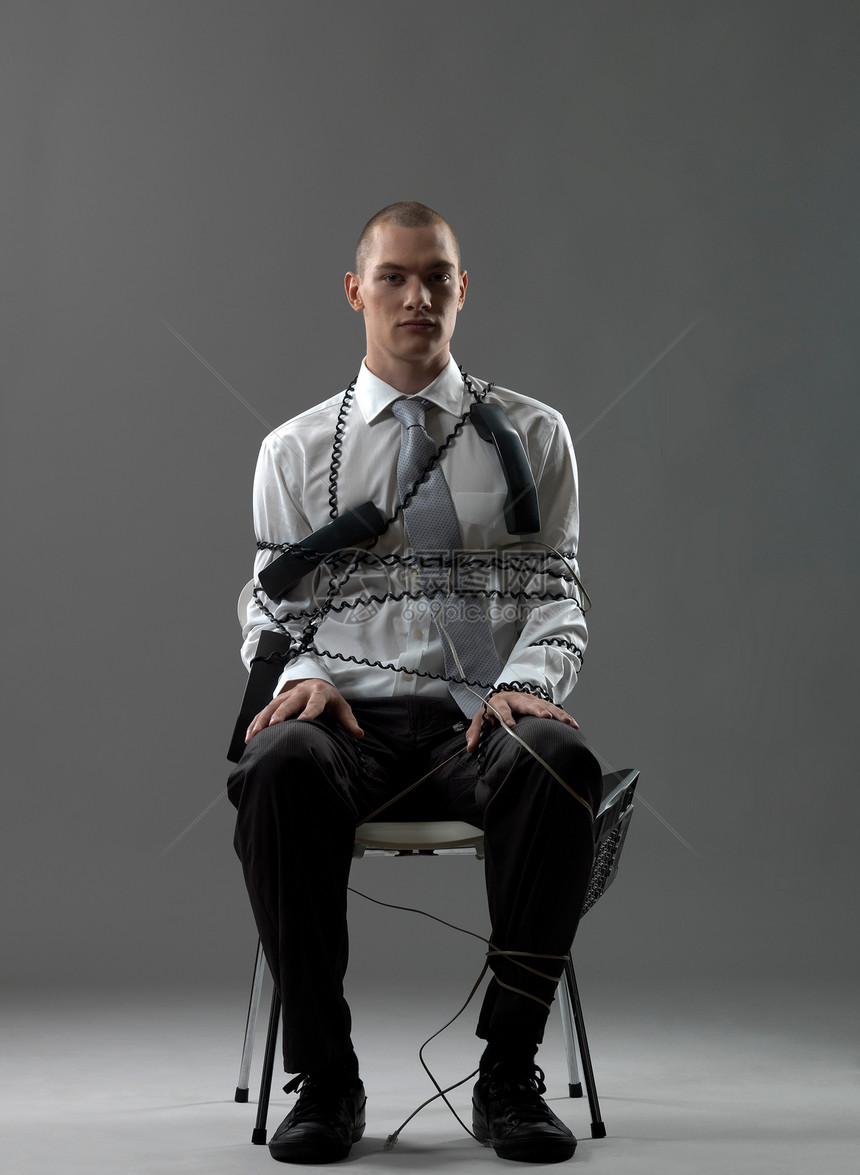 坐在椅子上的商人图片
