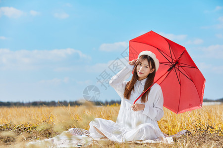 文艺美女手撑红色雨伞高清图片