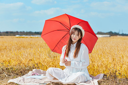 文艺美女手撑红色雨伞图片