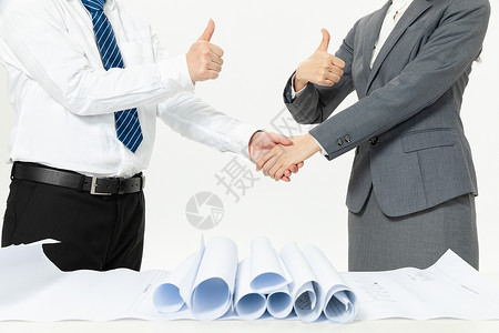 商务人士合作握手背景图片