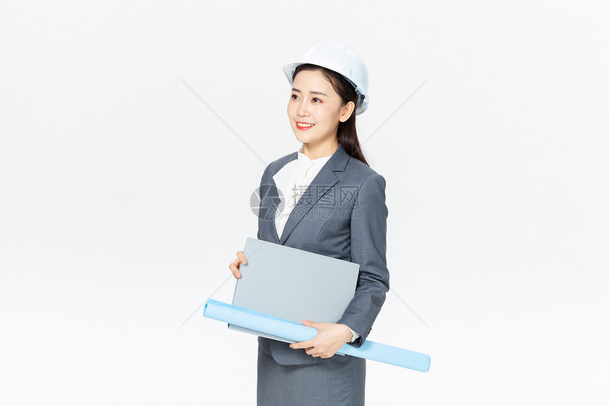 女性建筑工程师拿设计图图片